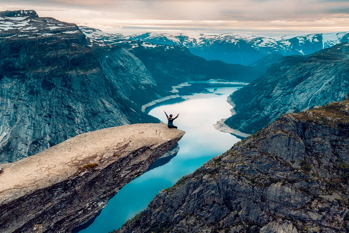 Women sitting on the mountain and celebrating